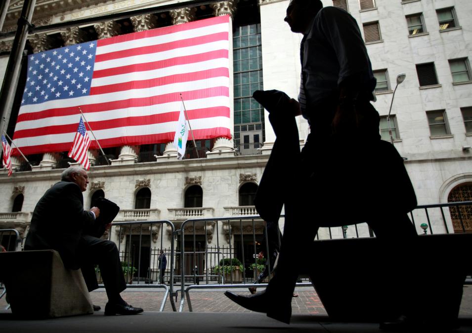 FILE PHOTO -  Morning commuters are seen outside the New York Stock Exchange