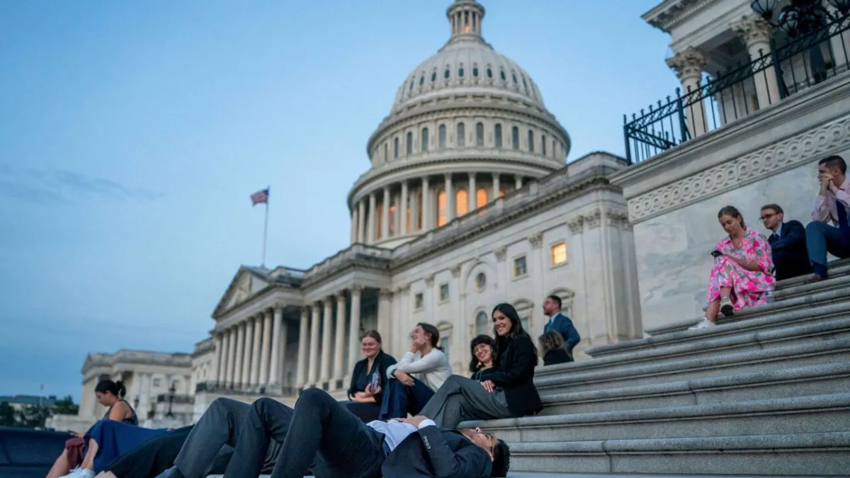 Senate staffers rested on the Capitol steps at sunrise. Senate staffers rested on the Capitol steps at sunrise.