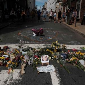 Flowers and a photo of car ramming victim Heather Heyer lie at a makeshift memorial in Charlottesville