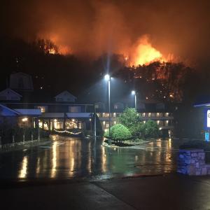 A wildfire burns on a hillside after a mandatory evacuation was ordered in Gatlinburg