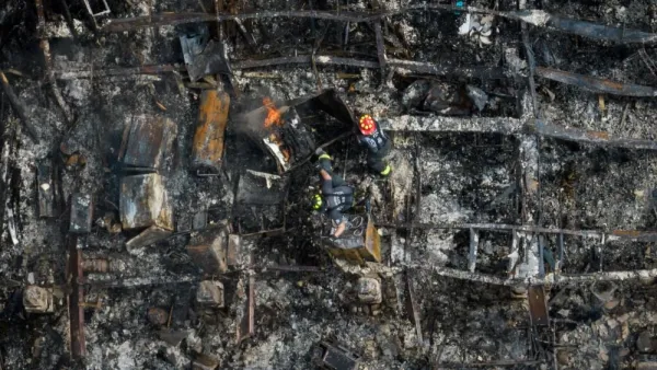 Firefighters attempt to put out a house fire in the aftermath of Hurricane Idalia.