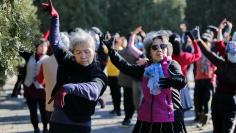 Women dance in a park in Beijing