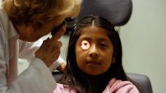 Uninsured patient has eye test at clinic in California