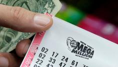 A ticket is seen ahead of the Mega Millions lottery draw which reached a jackpot of $415 Million in Manhattan, New York, U.S.