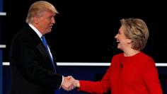 Republican U.S. presidential nominee Donald Trump and Democratic U.S. presidential nominee Hillary Clinton shake hands at the end of their first presidential debate at Hofstra University in Hempstead