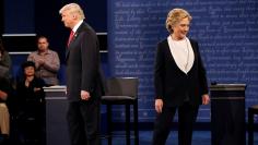 Republican U.S. presidential nominee Donald Trump and Democratic U.S. presidential nominee Hillary Clinton appear together during their presidential town hall debate at Washington University in St. Louis