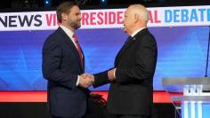 Ohio Sen. JD Vance, left, and Minnesota Gov. Tim Walz start their vice presidential debate Oct. 1 with a handshake.