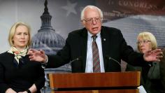 Senator Bernie Sanders (I-VT) speaks between Senators Kirsten Gillibrand (D-NY) and Patty Murray (D-WA) during a news conference to unveil the FAMILY Act on Capitol Hill in Washington