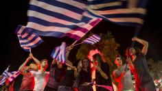"No" supporters celebrate referendum results on a street in central in Athens