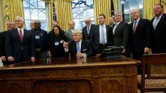 Trump gathers labor leaders in the Oval Office after their meeting at the White House in Washington