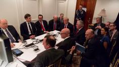 U.S. President Trump is shown in an official White House handout image meeting with his National  Security team at his Mar-a-Lago resort after a missile strike on Syria