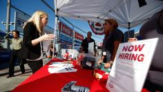 People browse booths at a military veterans' job fair in Carson