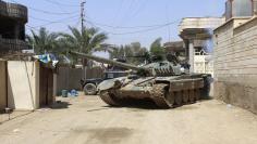 A tank of the Iraqi security forces is seen in the town of Hit