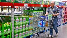 A customer shops along the cleaning product aisle at a Sam's Club store in Bentonville