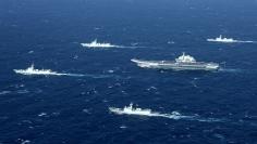 China's Liaoning aircraft carrier with accompanying fleet conducts a drill in an area of South China Sea