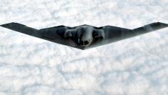 The B-2 Spirit stealth bomber flies over the Missouri Sky after taking off from the Whiteman Air For..