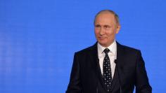Russian President Vladimir Putin delivers a speech at an oceanarium on Russky Island before attending the Eastern Economic Forum in Vladivostok