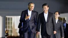 Obama and Xi walk to a private dinner in Washington