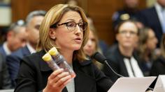Mylan NL CEO Heather Bresch holds EpiPens during a House Oversight and Government Reform Committee hearing on the Rising Price of EpiPens at the Capitol in Washington