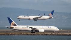 A United Airlines 787 taxis as a United Airlines 767 lands at San Francisco International Airport, San Francisco