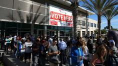 People line up to vote early outside the San Diego County Elections Office in San Diego, California