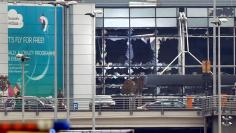 Broken windows seen at the scene of explosions at Zaventem airport near Brussels, Belgium