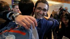 Behnam Partopour, a Worcester Polytechnic Institute student from Iran, is greeted by friends at Logan Airport after he cleared U.S. customs and immigration on an F1 student visa in Boston