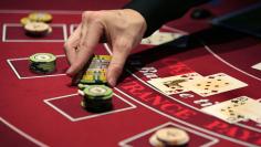 A croupier deals a hand for a poker at the new Casino Barriere in Toulouse