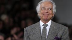 Designer Ralph Lauren acknowledges the crowd following the Fall/Winter 2012 collection during New York