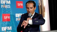FILE PHOTO: Patrick Drahi, Franco-Israeli businessman and Executive Chairman of cable and mobile telecoms company Altice, speaks during the launch of the news channel BFM Paris, in Paris, France, November 7, 2016. REUTERS/Benoit Tessier/File Photo