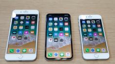FILE PHOTO: (L-R) iPhone 8 Plus, iPhone X and iPhone 8 models are displayed during an Apple launch event in Cupertino, California, U.S., September 12, 2017. REUTERS/Stephen Lam/File Photo