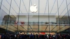 People line up outside an Apple store as iPhone SE goes on sale in China, in Hangzhou
