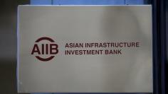 The signboard of Asian Infrastructure Investment Bank (AIIB) is seen at its headquarter building in Beijing January 17, 2016.REUTERS/Kim Kyung-Hoon - GF20000097619