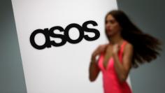 FILE PHOTO:FILE PHOTO - A model walks on an in-house catwalk at the ASOS headquarters in London