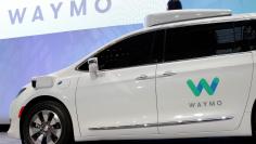 FILE PHOTO: Waymo unveils a self-driving Chrysler Pacifica minivan during the North American International Auto Show in Detroit, Michigan, U.S., January 8, 2017.  REUTERS/Brendan McDermid/File Photo