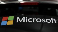 The Microsoft logo is shown on an electric car at the Auto Show in Los Angeles