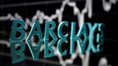 The Barclays logo is seen in front of displayed stock graph in this illustration