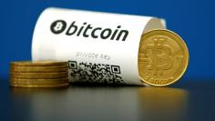 FILE PHOTO - A Bitcoin (virtual currency) paper wallet with QR codes and a coin are seen in an illustration picture taken at La Maison du Bitcoin in Paris, France, May 27, 2015. To match Special Report BITCOIN-WRIGHT/PATENTS     REUTERS/Benoit Tessier/Fi
