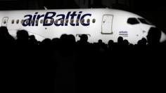 File picture: Bombardier employees look on as they announce the delivery of the first CS300 aircraft to Air Baltic Corporation AS (airBaltic) in Mirabel, Quebec, Canada November 28, 2016.  REUTERS/Christinne Muschi