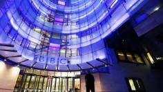 FILE PHOTO - A man enters BBC New Broadcasting House in London