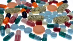 FILE PHOTO: Pharmaceutical tablets and capsules are arranged on table in a photo illustration