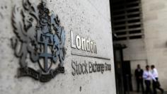 Pedestrians leave and enter the London Stock Exchange in London, Britain August 15, 2017. REUTERS/Neil Hall