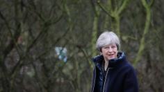 Britain's Prime Minister Theresa May walks through the Wildfowl and Wetland Trust's (WWT) grounds ahead of a speech to launch the government's environment plan at the London Wetland Centre in west London