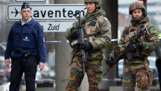 Belgian troops and police control a road leading to Zaventem airport following Tuesday's airport bombings in Brussels, Belgium, March 24, 2016.   REUTERS/Charles Platiau