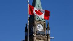 A Canadian flag flies in front of the Peace Tower on Parliament Hill in Ottawa, Ontario, Canada, March 22, 2017. REUTERS/Chris Wattie 