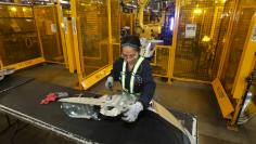 FILE PHOTO: Worker checks welded part from auto weld assembly line at Alfield Industries, a subsidiary of Martinrea, one of three global auto parts makers in Canada, in Vaughan, Ontario, Canada April 28, 2017.  REUTERS/Fred Thornhill/File Photo 