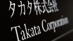 Takata Corp's company plate is seen at an entrance of the building where the Takata Corp headquarters is located in Tokyo