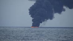Flames and smoke from the Iranian oil tanker Sanchi is seen in the East China Sea