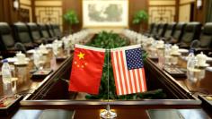 FILE PHOTO: Flags of U.S. and China are placed for a meeting between Secretary of Agriculture Sonny Perdue and China's Minister of Agriculture Han Changfu at the Ministry of Agriculture in Beijing, China June 30, 2017. REUTERS/Jason Lee 