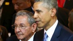 Cuba's President Raul Castro stands with his U.S. counterpart Barack Obama before the inauguration of the VII Summit of the Americas in Panama City 